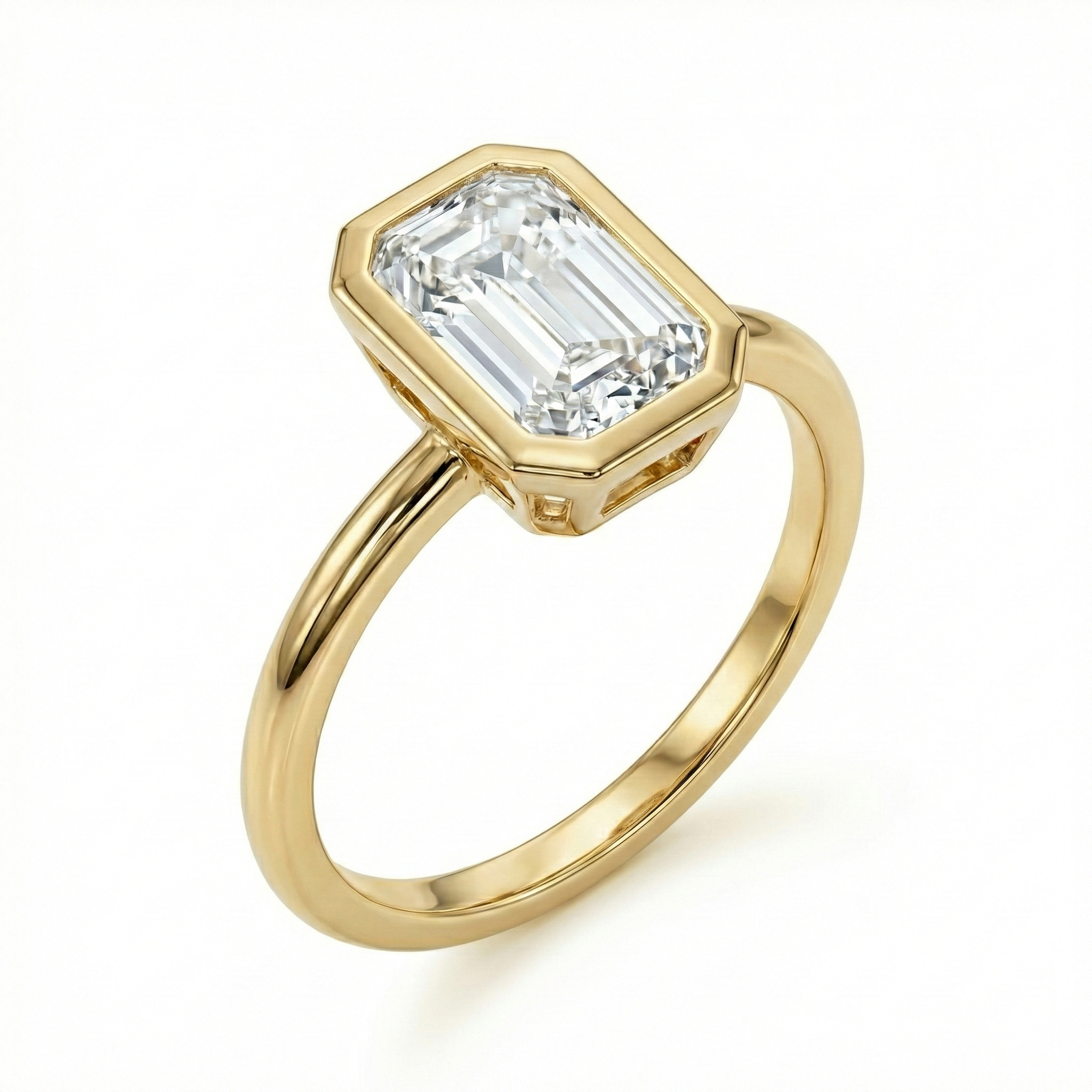 3/4 perspective showing the open gallery design of a 14K gold emerald cut diamond bezel ring.