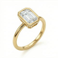 3/4 perspective showing the open gallery design of a 14K gold emerald cut diamond bezel ring.