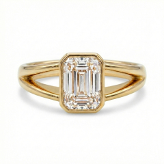 Front profile of a clear E color VVS2 emerald cut lab grown diamond in a modern minimalist bezel setting.