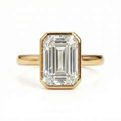 Macro front view of IGI certified E color VVS2 2ct emerald cut lab grown diamond in bezel setting