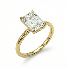 Front profile of a bespoke 4-carat emerald cut lab-grown diamond engagement ring set in 14K yellow gold, showcasing the hall of mirrors effect.