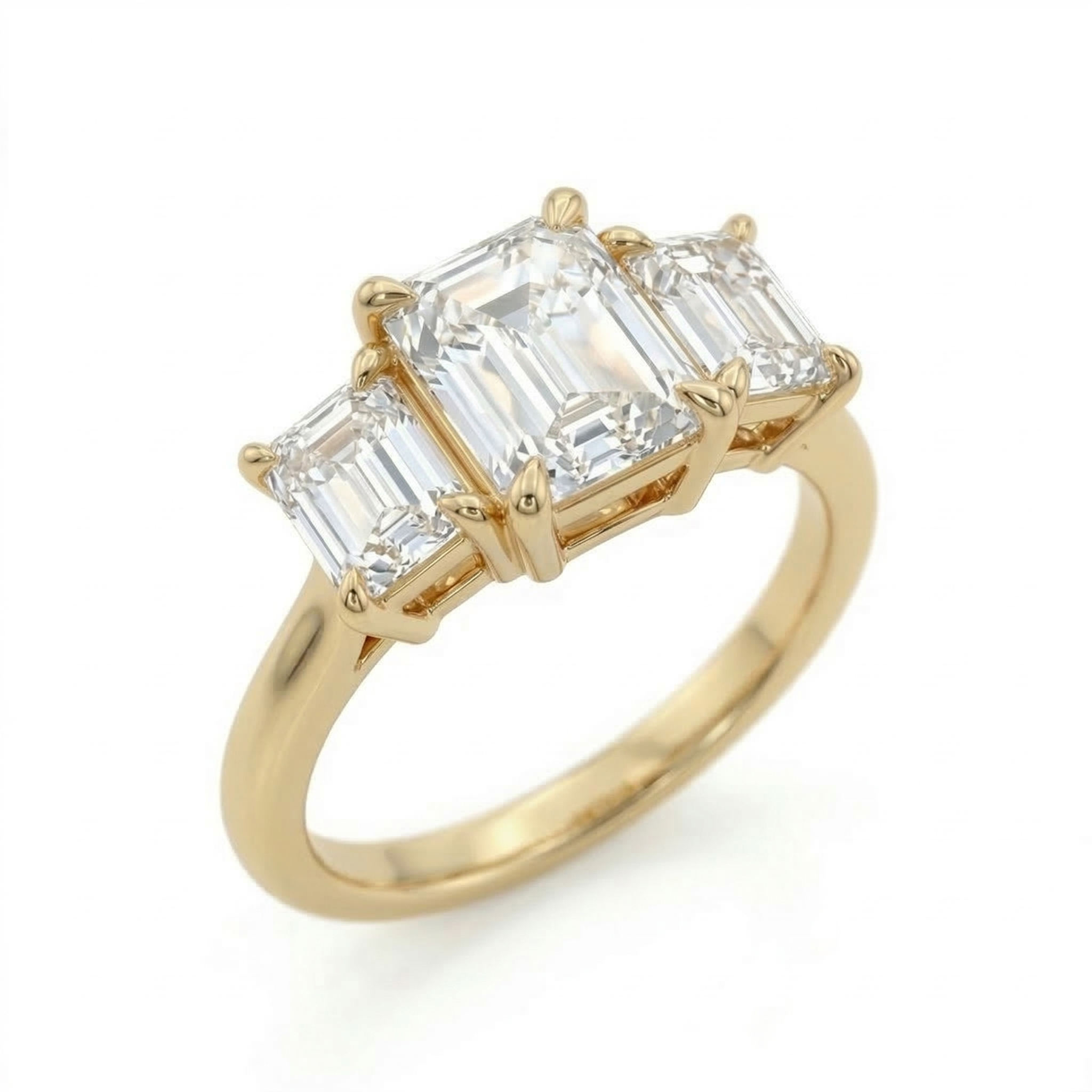 Angled close-up focusing on the architectural step-cut facets and secure 14K gold claw prongs of a 2.75 carat emerald cut lab-grown diamond.
