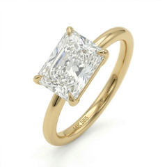 Angled studio shot of a factory-direct 1.1ct radiant cut lab diamond engagement ring featuring an east-west orientation, illustrating the pristine facet alignment, 3EX cut quality, and the smooth comfort-fit 14K gold shank