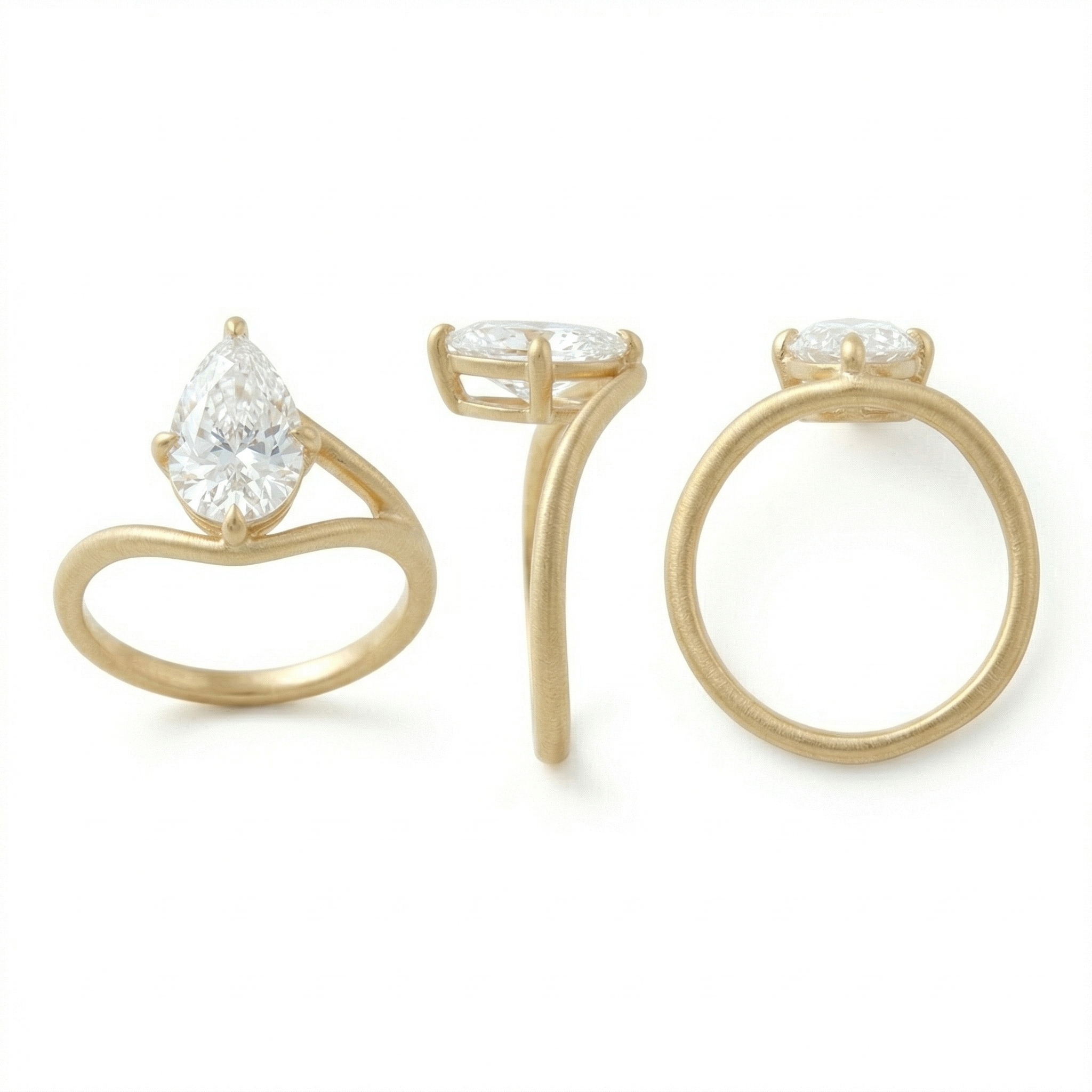 Three-angle view of a 3 carat pear cut lab grown diamond engagement ring featuring a matte 14K gold bypass band and an E color VVS2 center stone in a claw setting.