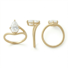 Three-angle view of a 3 carat pear cut lab grown diamond engagement ring featuring a matte 14K gold bypass band and an E color VVS2 center stone in a claw setting.
