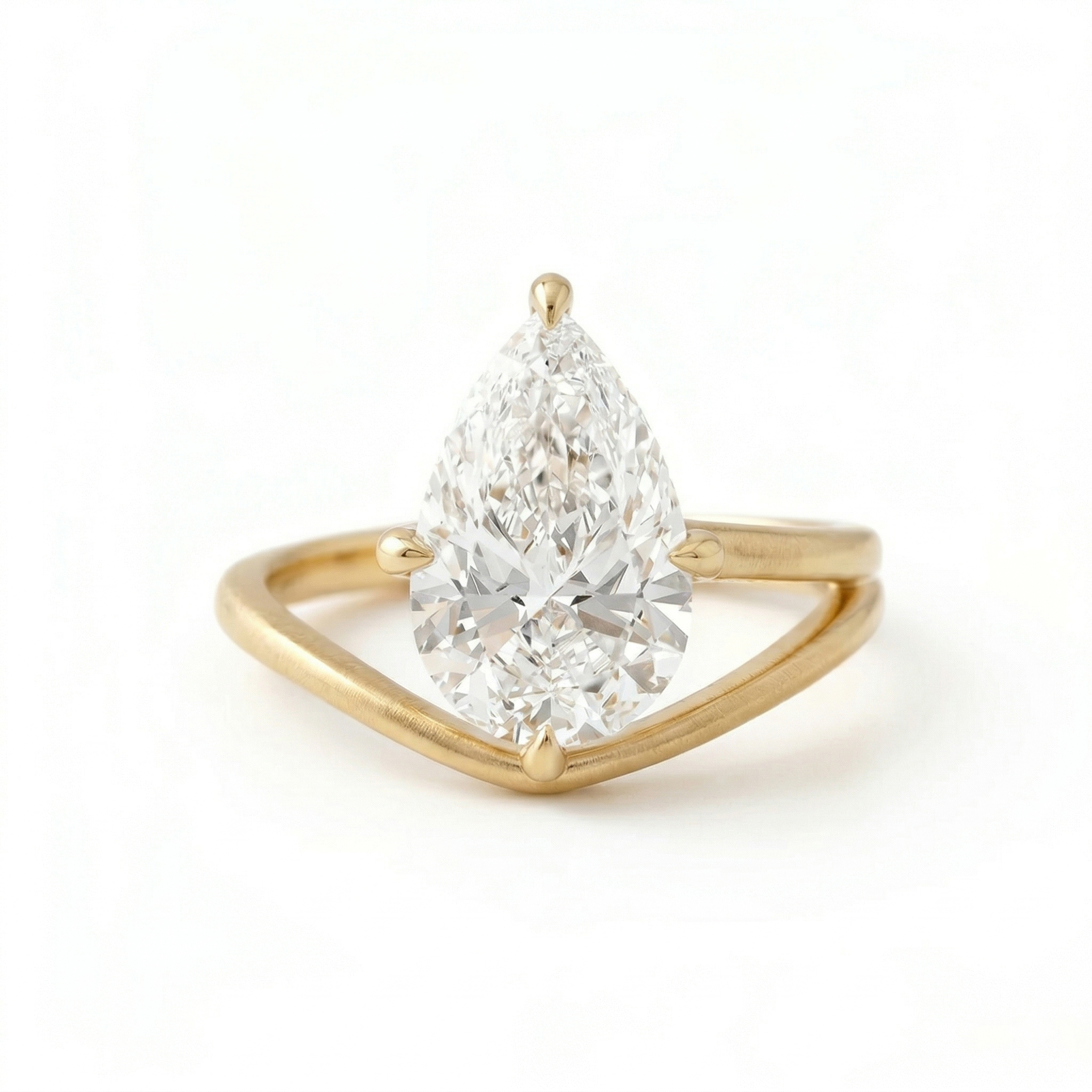 Front view of an excellent cut 3 carat pear shape lab grown diamond ring, illustrating maximum light performance and fire against a modern 14K matte gold setting.