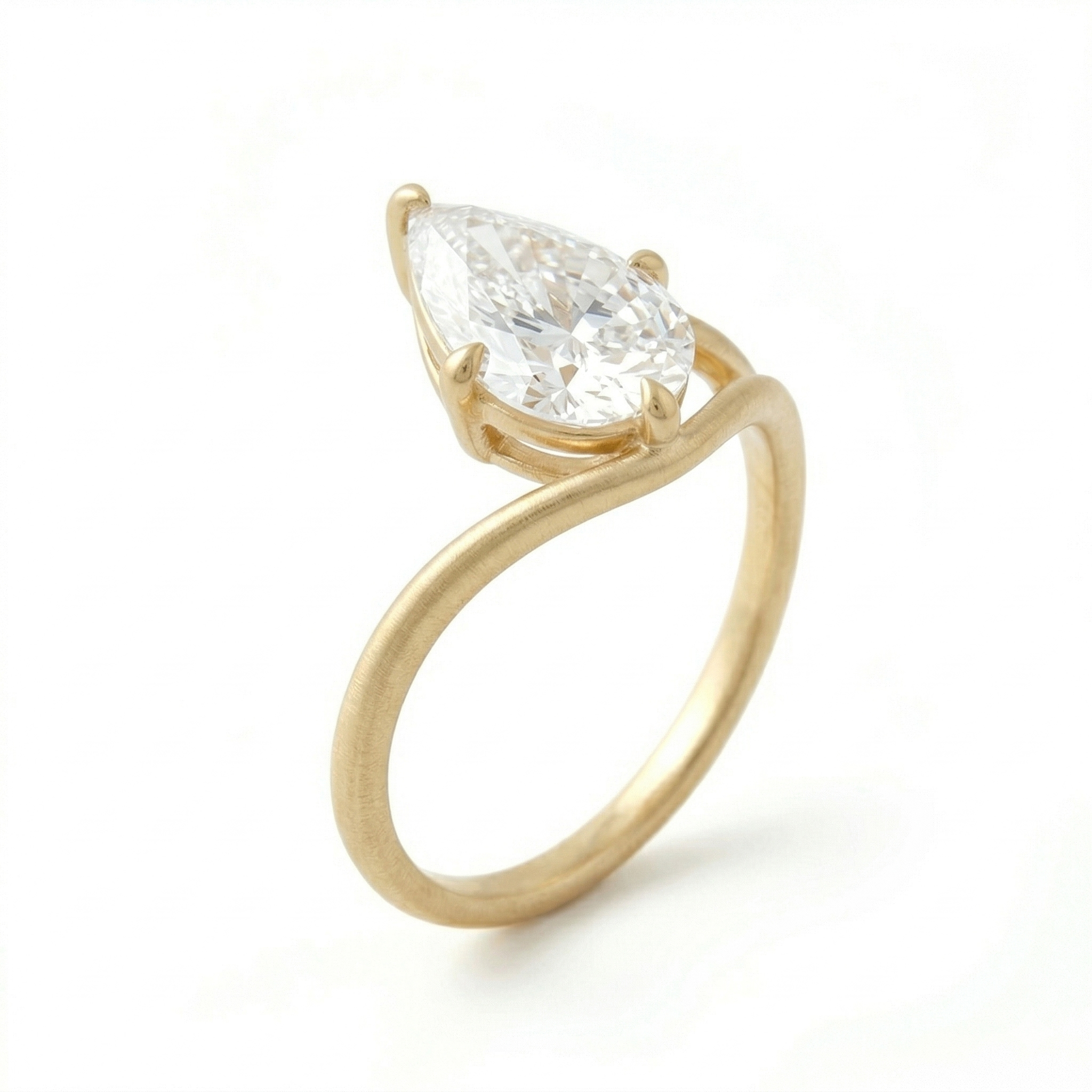 Side-angle perspective of a 3 carat pear lab grown diamond engagement ring crafted by an 18-year direct source manufacturer, featuring a unique matte 14K gold setting.