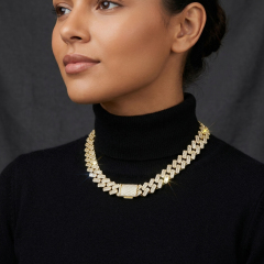 Elegant female model wearing a black turtleneck paired with a sparkling 10mm VVS moissanite diamond alternative iced out necklace.