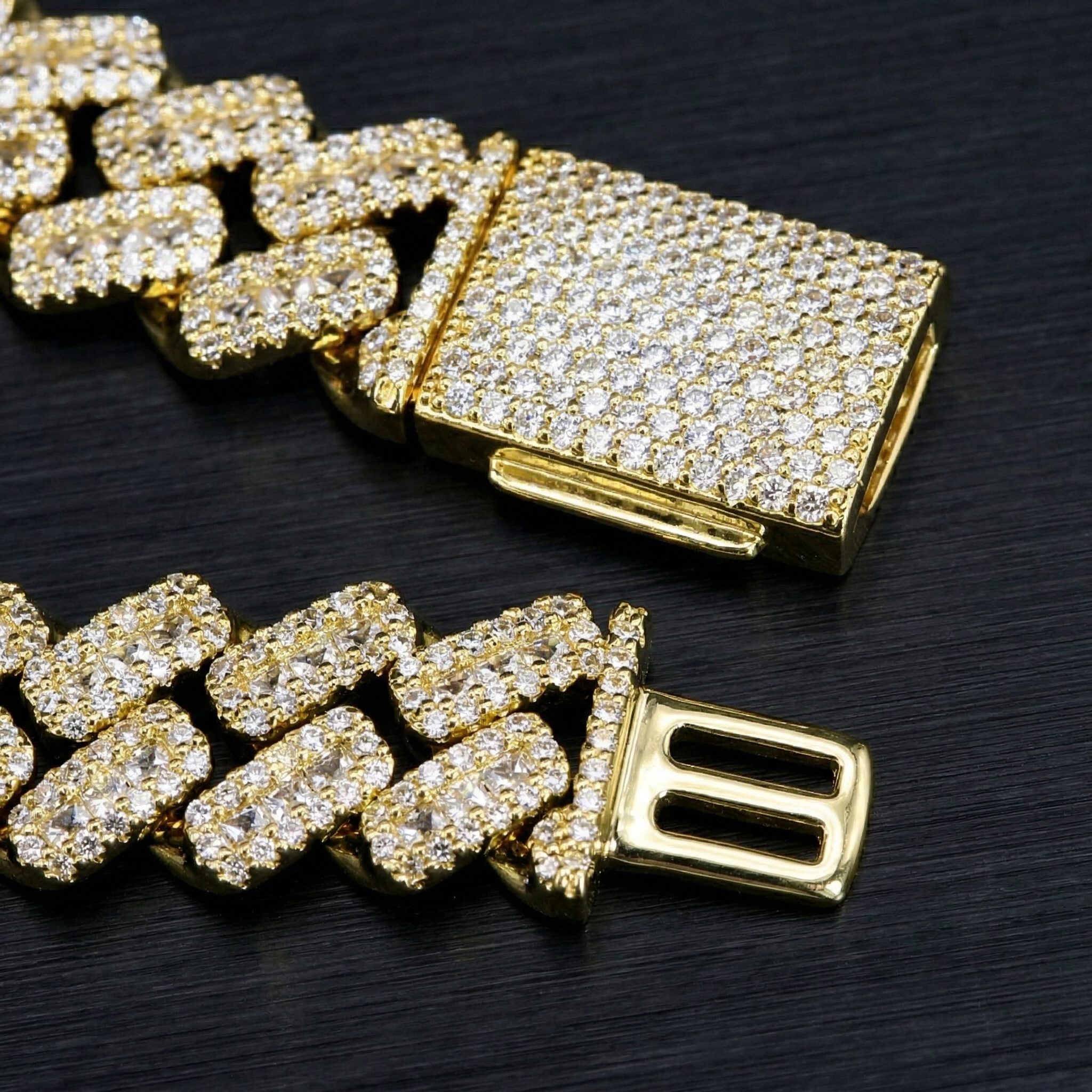 Macro photography detailing the heavy-duty fold-over box clasp of the moissanite bracelet, engineered by an 18-year source jewelry manufacturer.