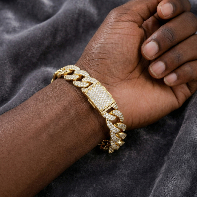 Close-up macro view of the 13mm moissanite Cuban bracelet on a man's wrist, focusing on the high-quality micro-pave setting and the heavy-duty iced out clasp.