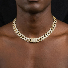 Front profile of a male model wearing a 13mm iced out moissanite Cuban necklace, emphasizing the luxurious aesthetic of lab-created diamond alternatives.