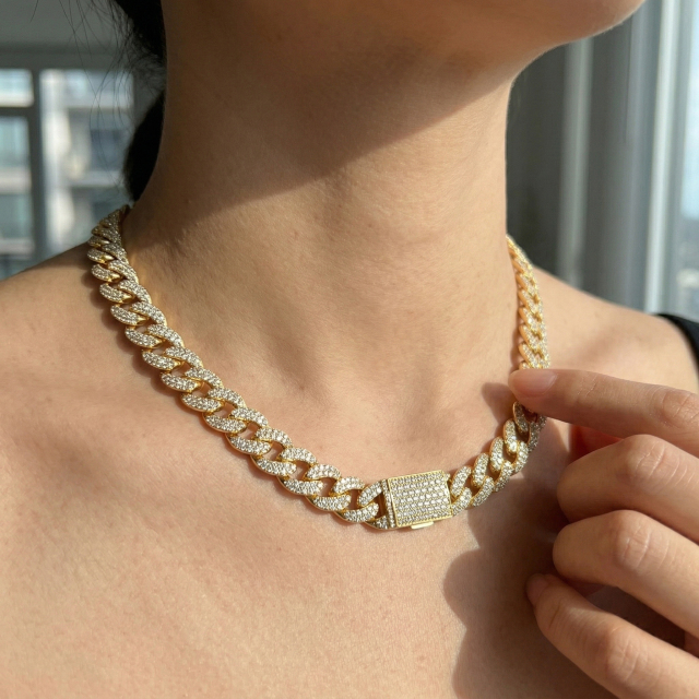 Female model wearing a matching customized iced out moissanite Cuban link necklace, showcasing our 18-year factory manufacturing capabilities.