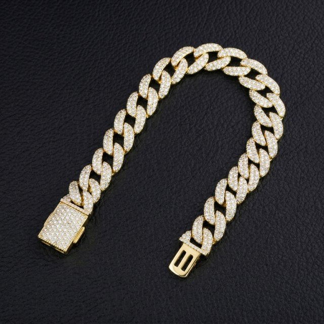 13mm S925 silver moissanite Cuban bracelet folded on a dark leather surface, illustrating the fluid flexibility and anti-roll thin profile engineering.