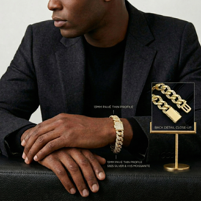 Male model in a black suit wearing a 13mm pave thin profile moissanite Cuban link bracelet, demonstrating the ergonomic flat fit on the wrist.