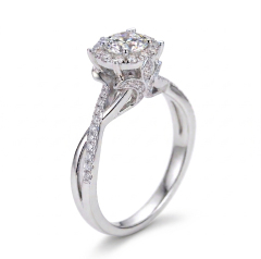 Side profile of an elegant engagement ring showcasing the ornate filigree petal basket setting that elevates the brilliant round center diamond.