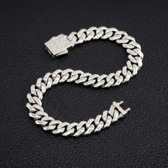 10mm VVS moissanite Cuban link bracelet in S925 sterling silver shaped in an S curve, displaying an iced-out box clasp.