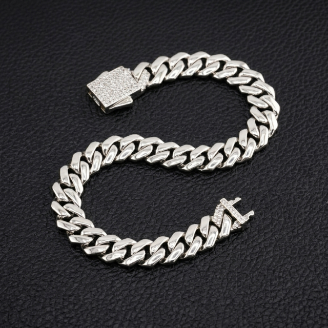 10mm VVS moissanite Cuban link bracelet in S925 sterling silver shaped in an S curve, displaying an iced-out box clasp.