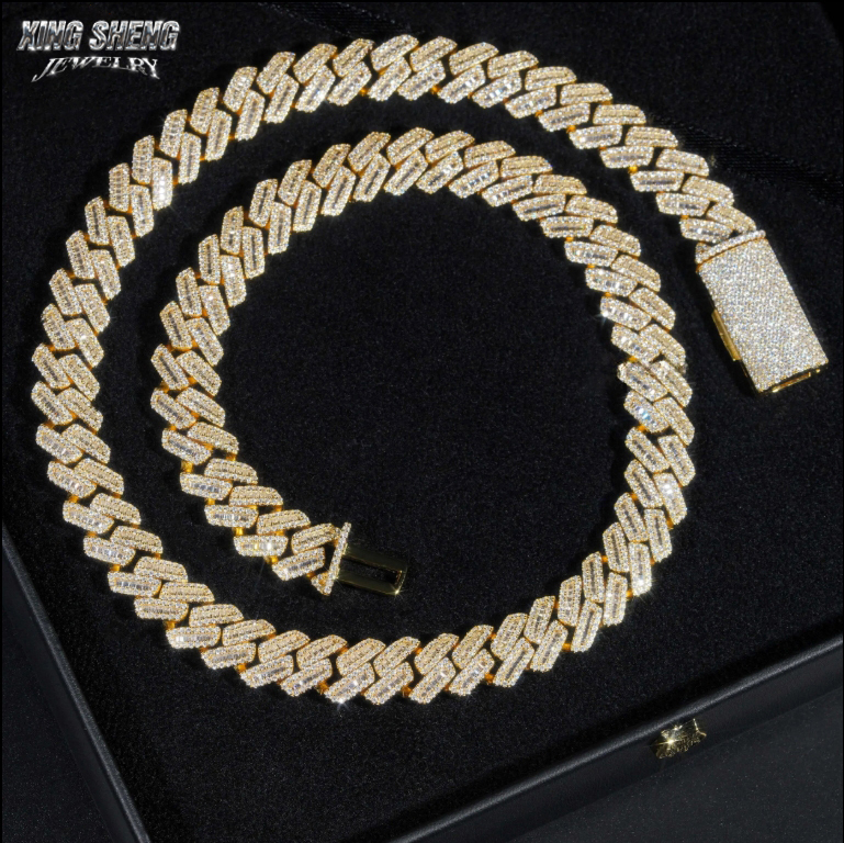 High-contrast presentation of the 15mm iced out moissanite hip hop chain against a dark background, highlighting the intense brilliance and icy white D-E color of the gemstones.