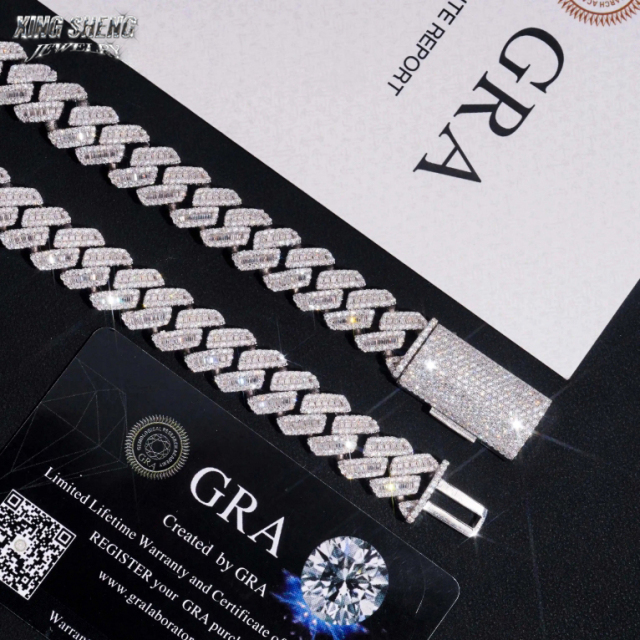 Macro detail shot of the 15mm moissanite Cuban link chain resting alongside the official GRA black warranty card, guaranteeing the lifetime brilliance of the VVS D-E color stones.