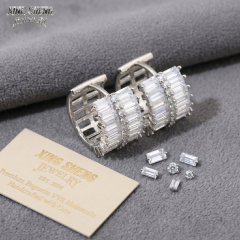 Premium baguette VVS moissanite earrings displayed with loose round and baguette stones and a Xing Sheng Jewelry brand certificate card.