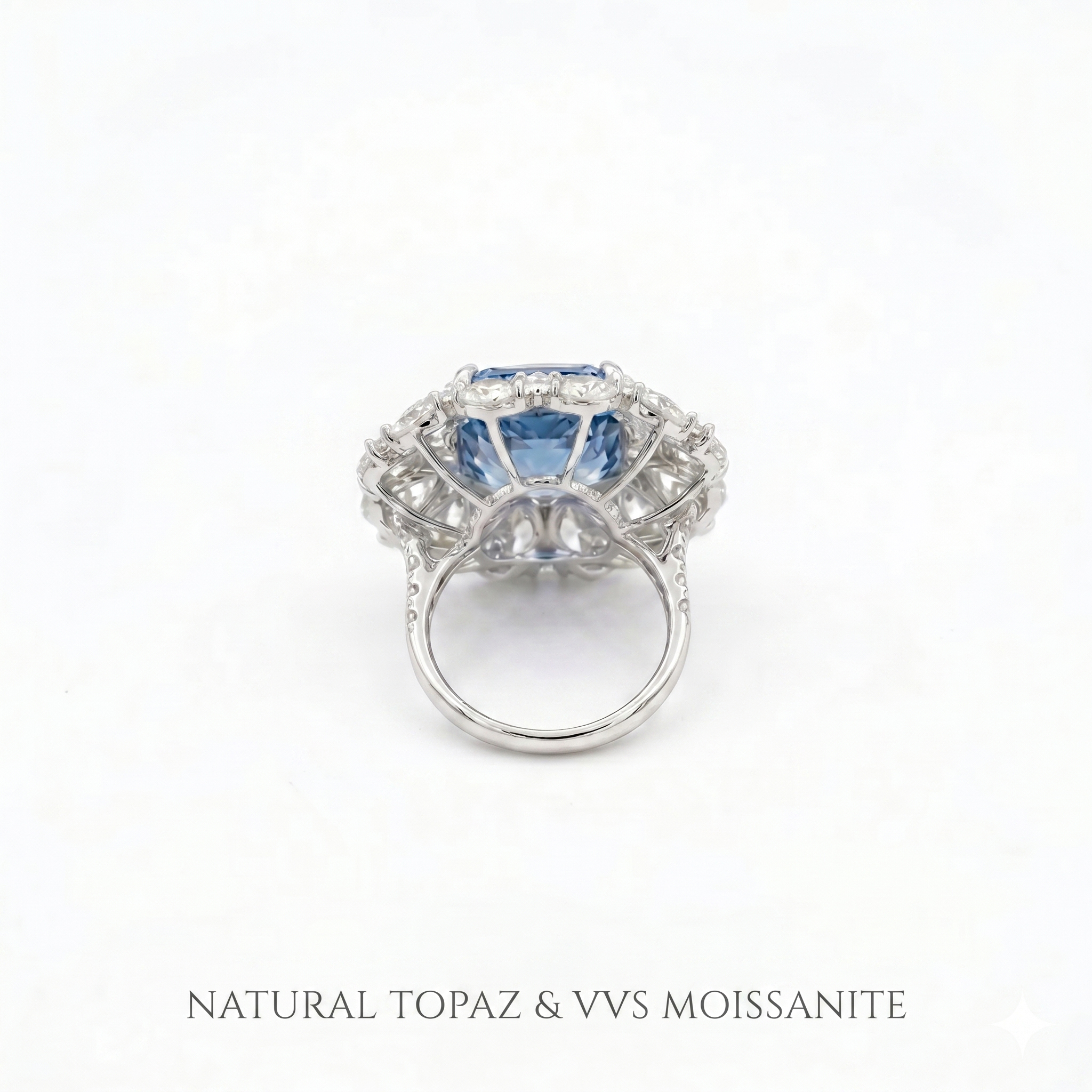 Bottom view of the solid gold ring band and setting structure, featuring the text "NATURAL TOPAZ & VVS MOISSANITE" to guarantee gemstone authenticity and premium quality.