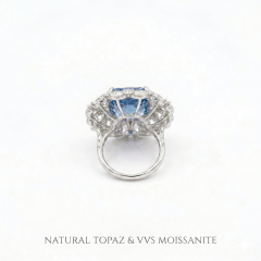 Bottom view of the solid gold ring band and setting structure, featuring the text "NATURAL TOPAZ & VVS MOISSANITE" to guarantee gemstone authenticity and premium quality.