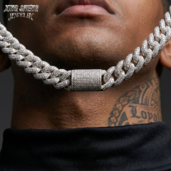 Close-up front view of a model wearing the heavyweight 16mm moissanite Cuban link chain, perfectly illustrating the seamless, hand-set micro-pavé stone arrangement and the eye-catching brilliance of the center box clasp.