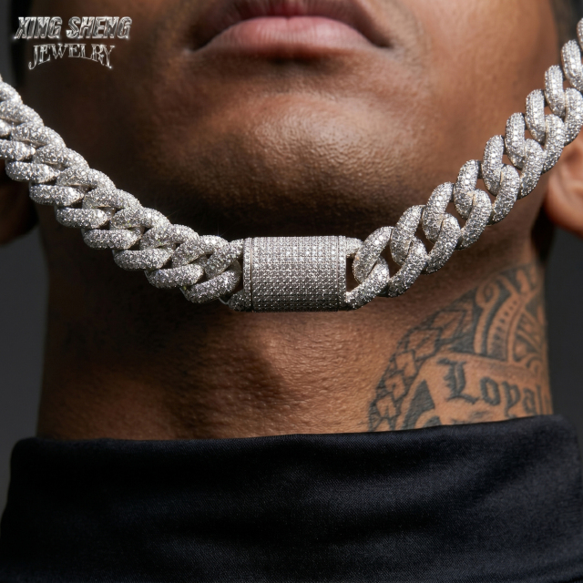 Close-up front view of a model wearing the heavyweight 16mm moissanite Cuban link chain, perfectly illustrating the seamless, hand-set micro-pavé stone arrangement and the eye-catching brilliance of the center box clasp.