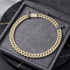 A luxurious 16mm gold moissanite Cuban link chain presented in a premium grey jewelry gift box reflecting bright light.