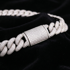 Extreme close-up of the heavy 16mm S925 silver moissanite Cuban link chain resting on black velvet, focusing on the precision micro-pavé VVS moissanite setting and the highly secure double-locking box clasp.