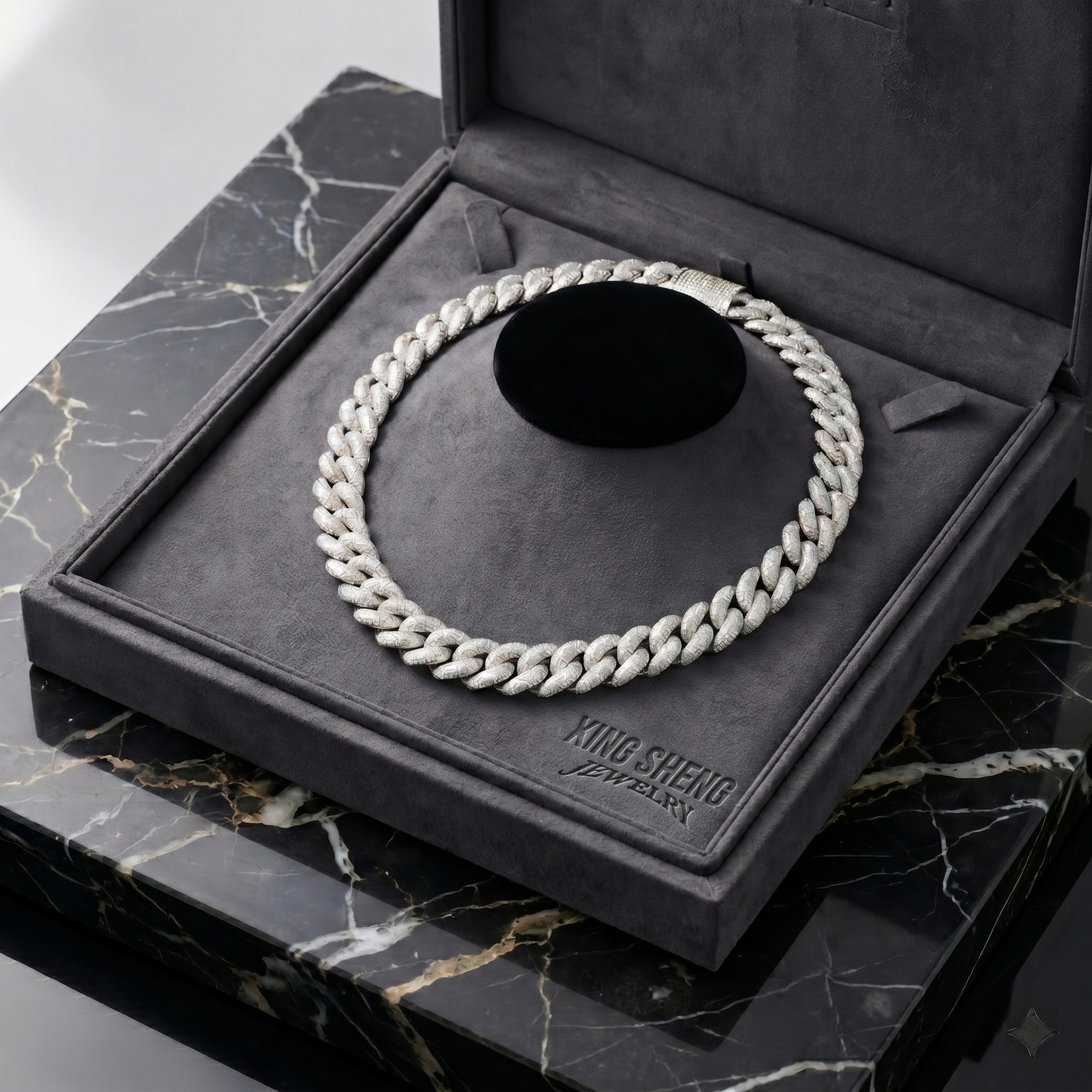 The masterpiece 16mm S925 silver rhodium-plated moissanite Cuban link chain resting elegantly on a plush grey display bust inside a custom engraved luxury presentation box.