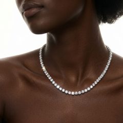 Close-up of a flawless 6A moissanite tennis choker necklace on a female model, emphasizing the secure prong setting and brilliant light return of the round stones.