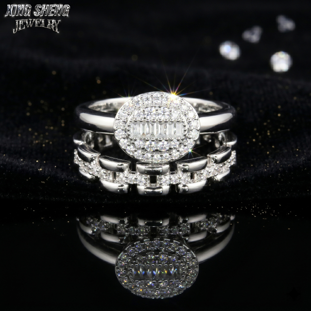 High brilliance straight baguette and round cut moissanite bridal set glowing on dark black velvet fabric.