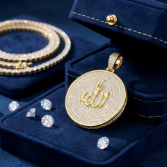 A luxurious D color VVS moissanite Allah pendant resting in a premium blue velvet jewelry box surrounded by loose brilliant round cut moissanite stones.