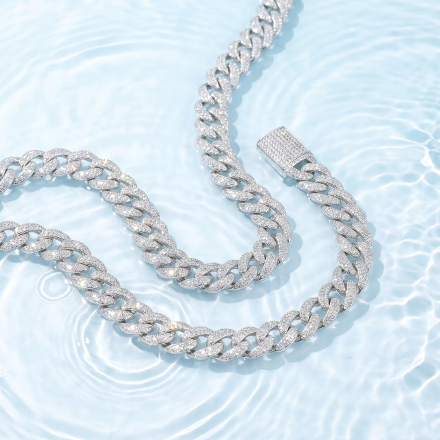 Close-up of the 13mm moissanite Cuban link chain in rhodium-plated S925 silver, showcasing its brilliant fire and anti-tarnish waterproof properties against a water background.