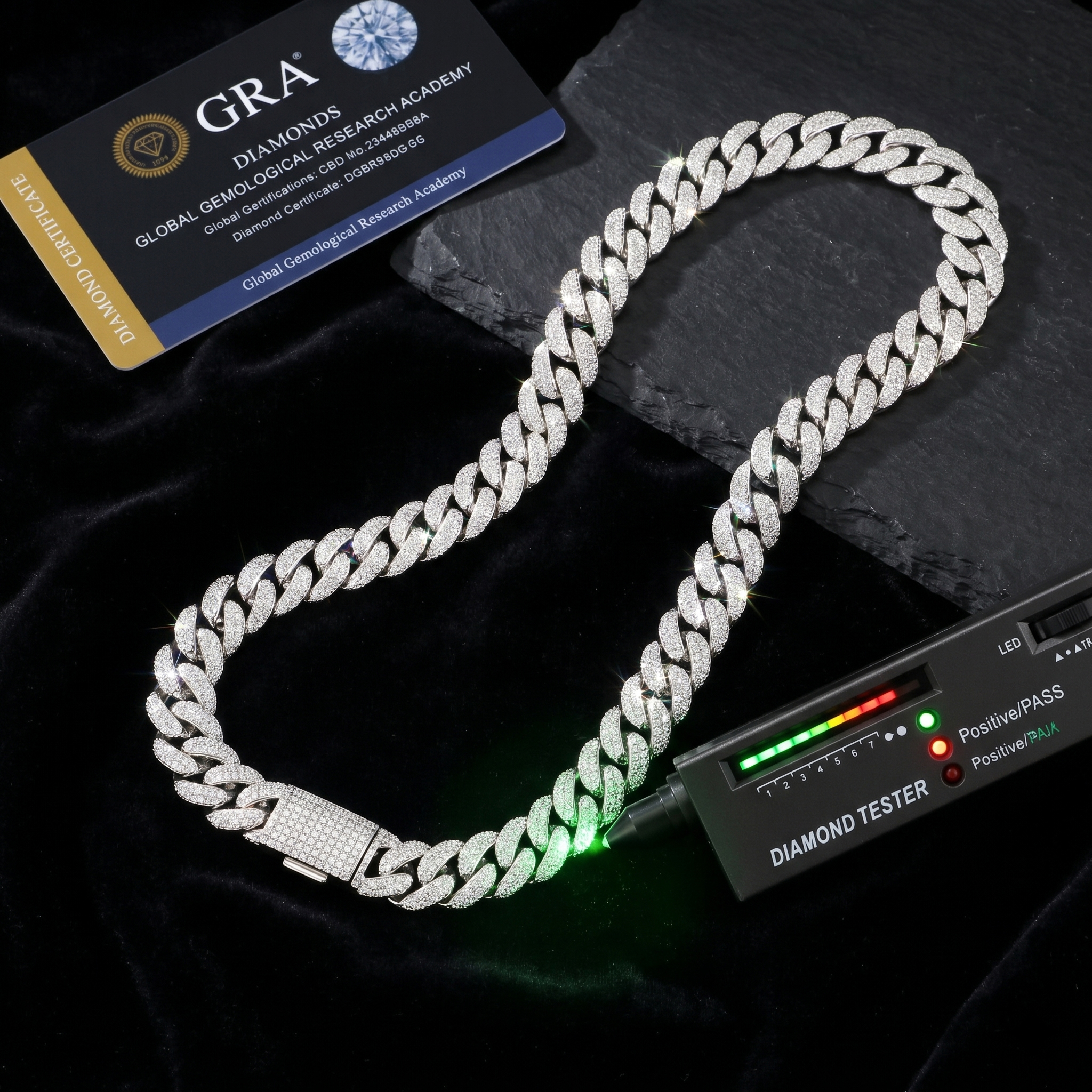 The 13mm iced out moissanite Cuban necklace glowing brilliantly against a dark velvet background, successfully passing a diamond tester next to its GRA documentation.