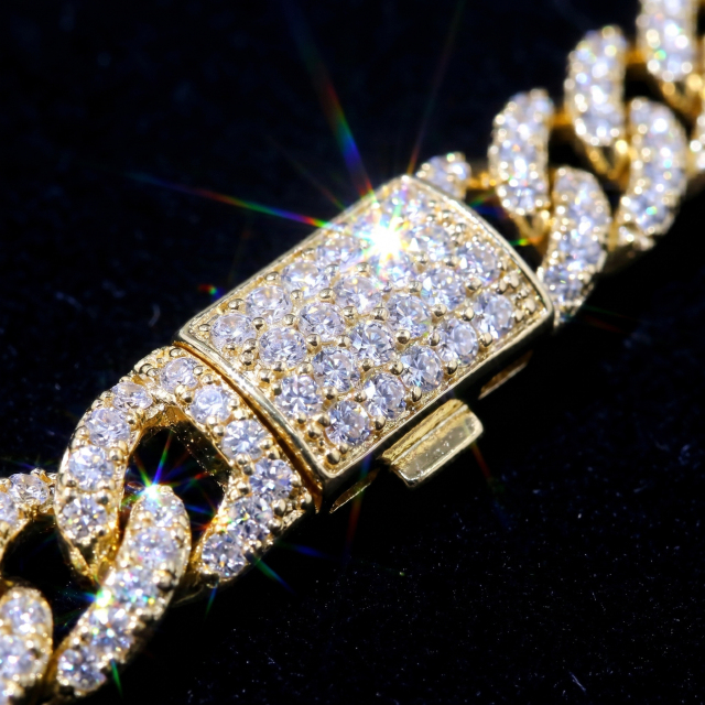 Extreme macro close-up of the seamless full-iced box clasp on the Moissanite Cuban chain, displaying intense rainbow fire and dispersion.