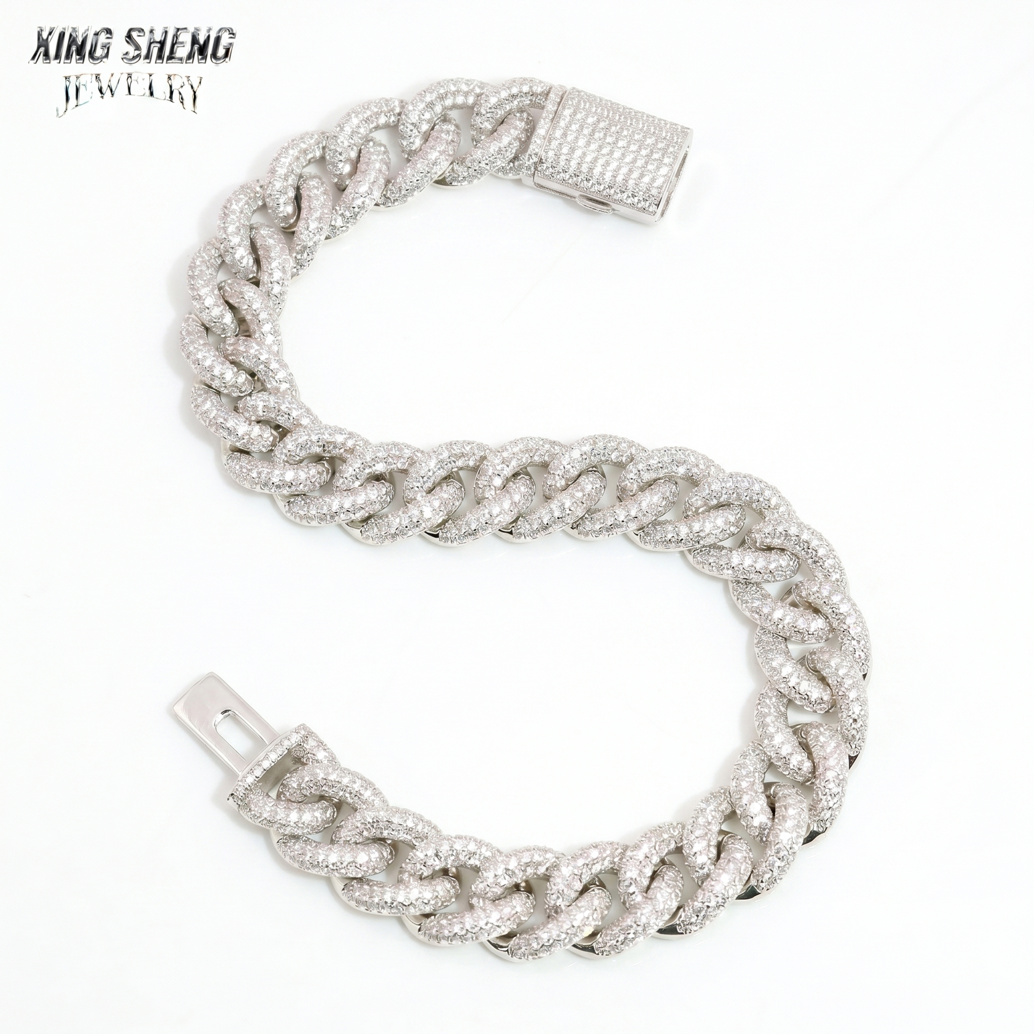 10MM iced out VVS moissanite Miami Cuban link bracelet laid in an S-shape on a white background