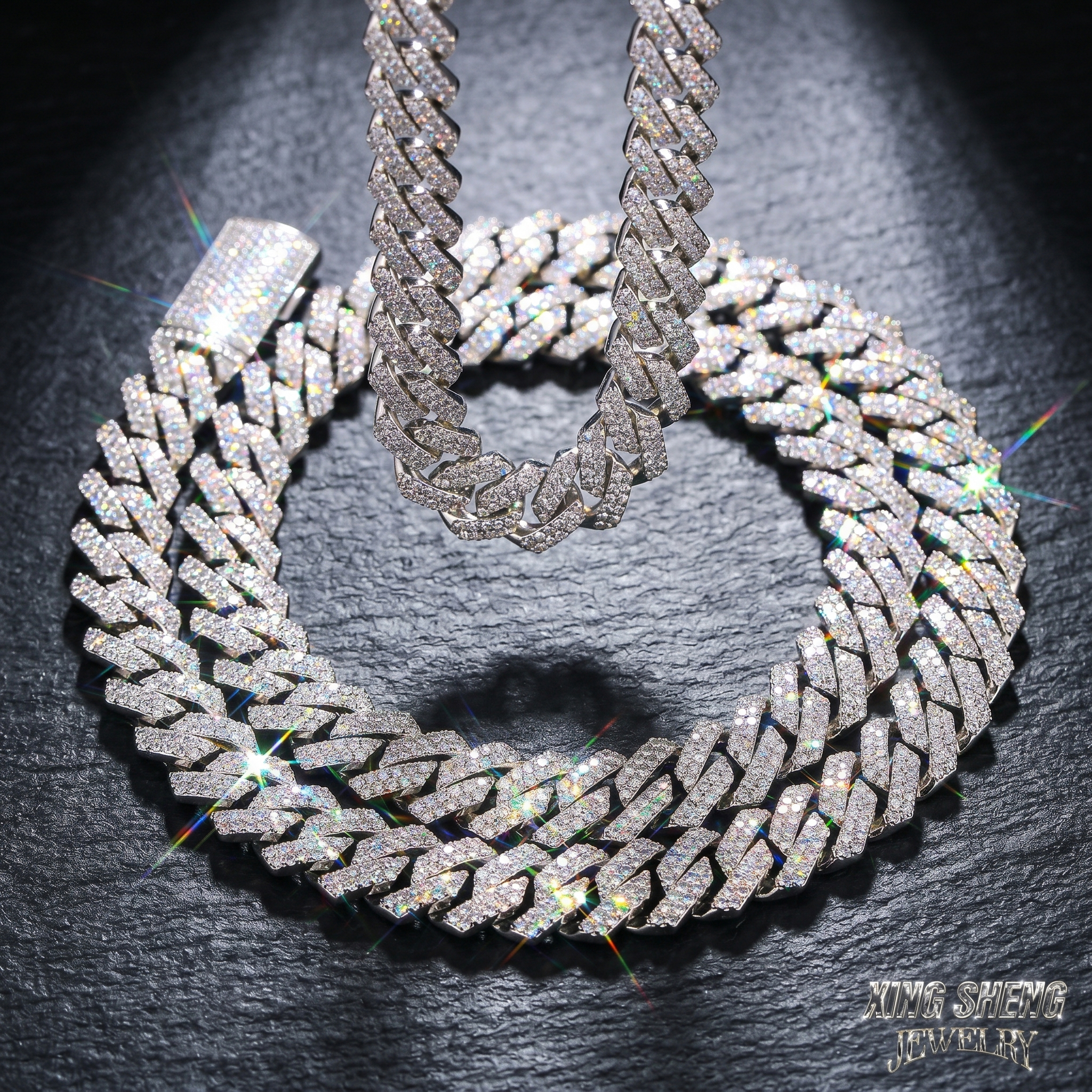 Brilliant optical fire and colorful dispersion shining from a 13MM moissanite Cuban necklace resting on a dark slate background.