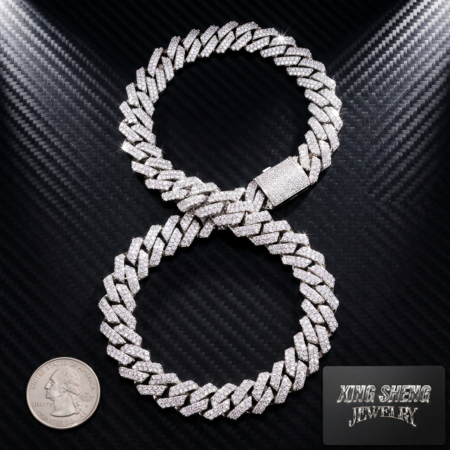 Heavy 13MM iced out moissanite Cuban chain arranged in a figure-eight shape next to a US quarter coin, demonstrating the massive width and solid build.