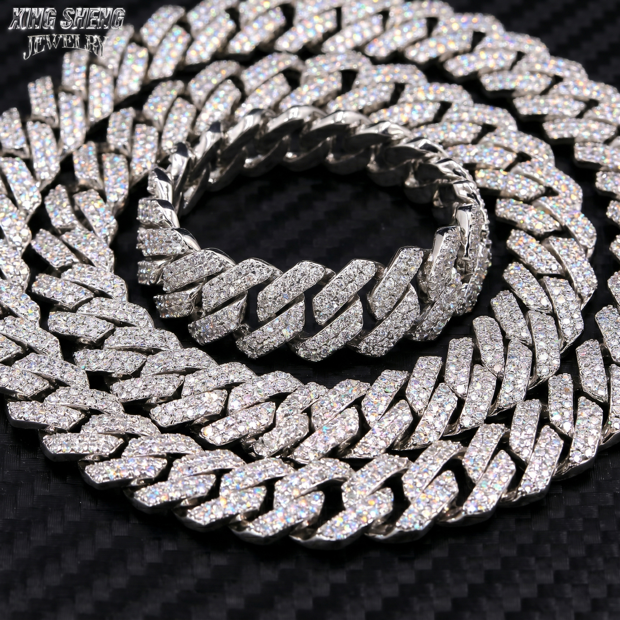 Tightly stacked solid S925 sterling silver 13MM moissanite Cuban chain on a carbon fiber background, showcasing its heavyweight luxury design.