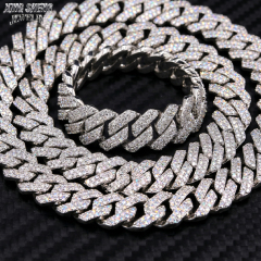 Tightly stacked solid S925 sterling silver 13MM moissanite Cuban chain on a carbon fiber background, showcasing its heavyweight luxury design.