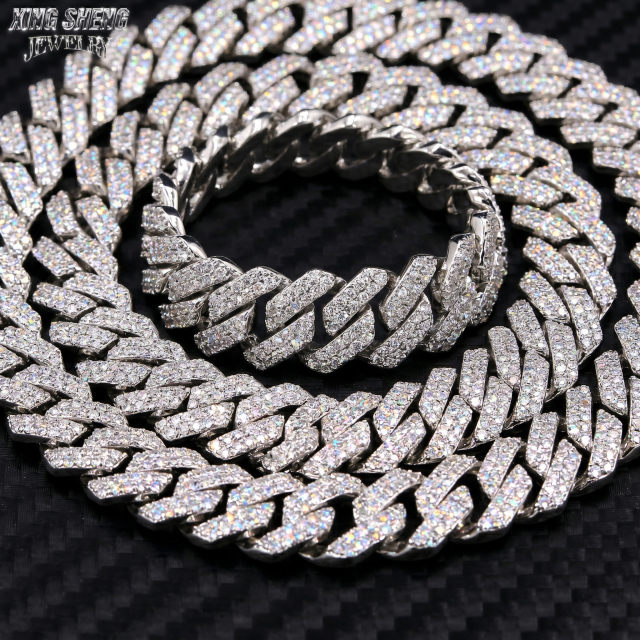 Tightly stacked solid S925 sterling silver 13MM moissanite Cuban chain on a carbon fiber background, showcasing its heavyweight luxury design.