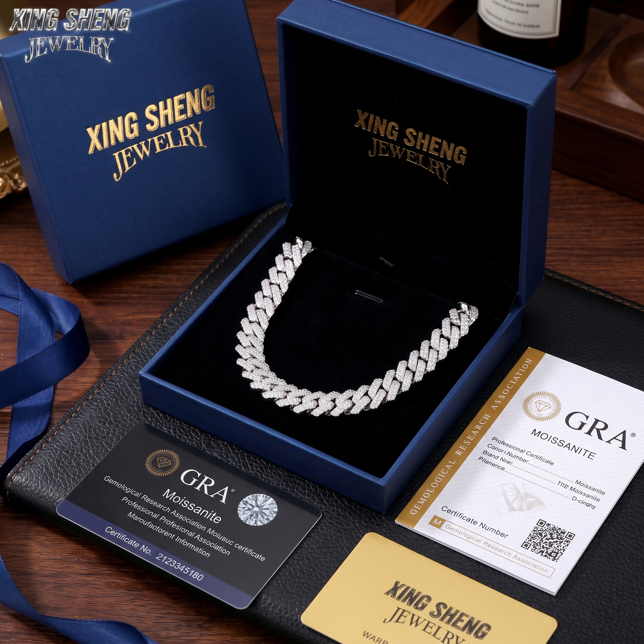 Luxury blue presentation gift box from Xing Sheng Jewelry containing the 13MM moissanite Cuban link chain, accompanied by official GRA certification cards.