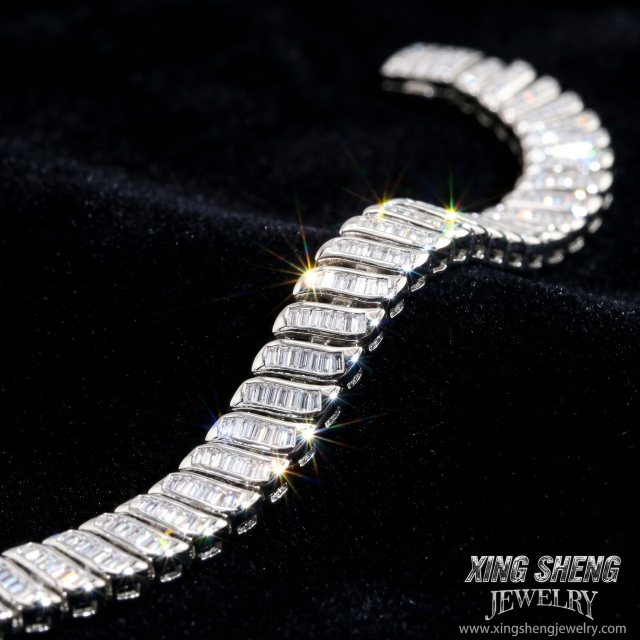 High-definition front macro view of the 8mm baguette cut moissanite tennis bracelet in S925 sterling silver with a brilliant white gold rhodium finish.