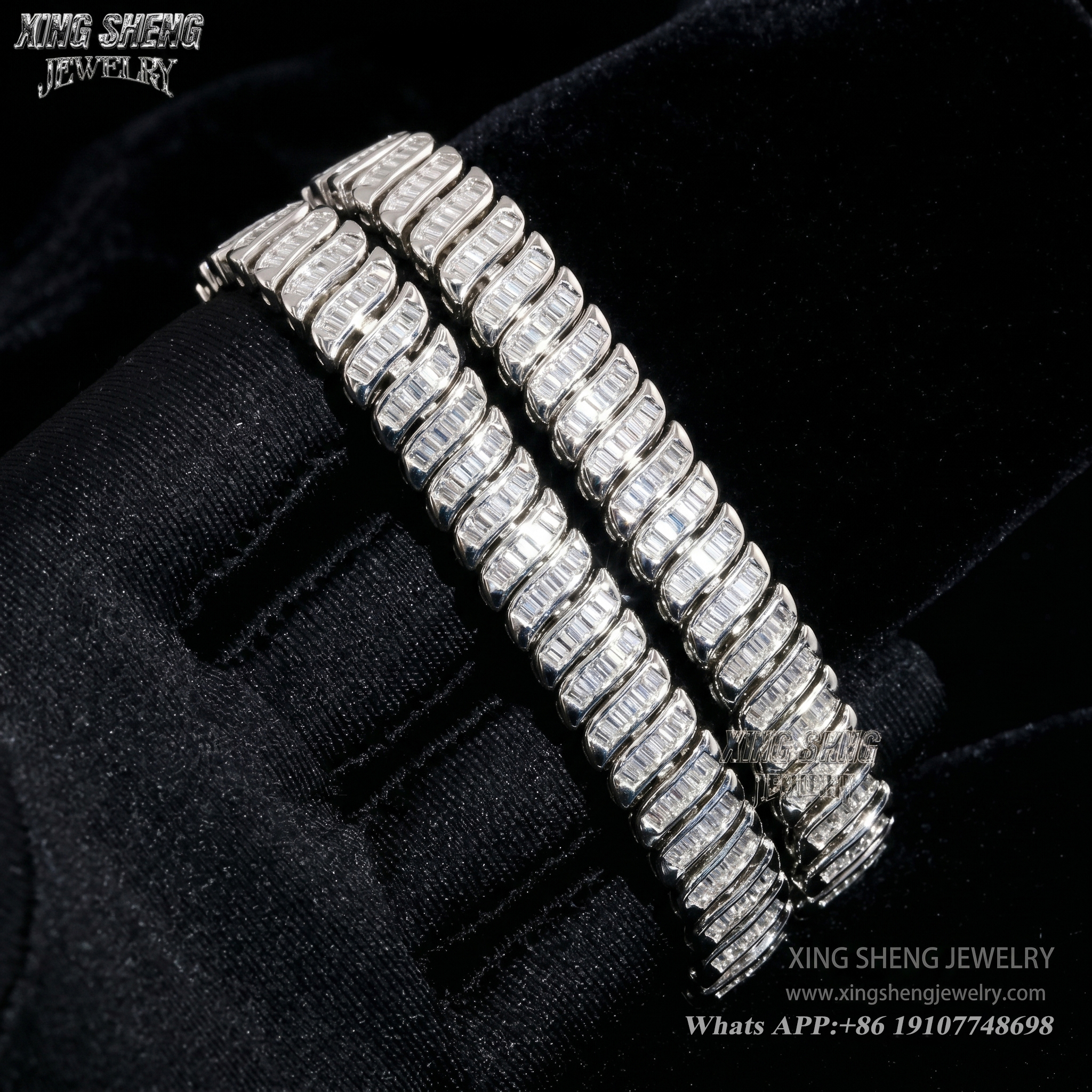 Two brilliant baguette cut moissanite bracelets draped over a black gloved hand, showcasing the intense light reflection and 6A quality fire.