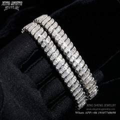 Two brilliant baguette cut moissanite bracelets draped over a black gloved hand, showcasing the intense light reflection and 6A quality fire.