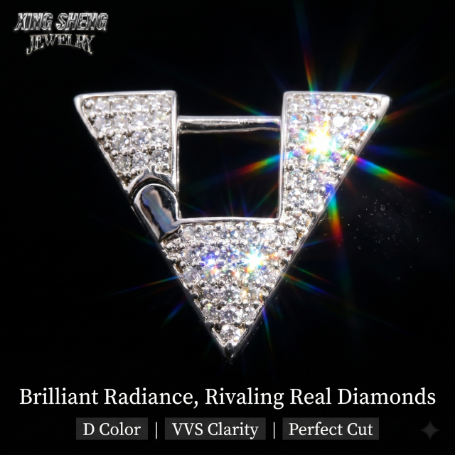 Dramatic lighting photography highlighting the exceptional rainbow dispersion, high refractive index, and spectacular fire of the 6A grade, round-cut moissanite stones against a black background.