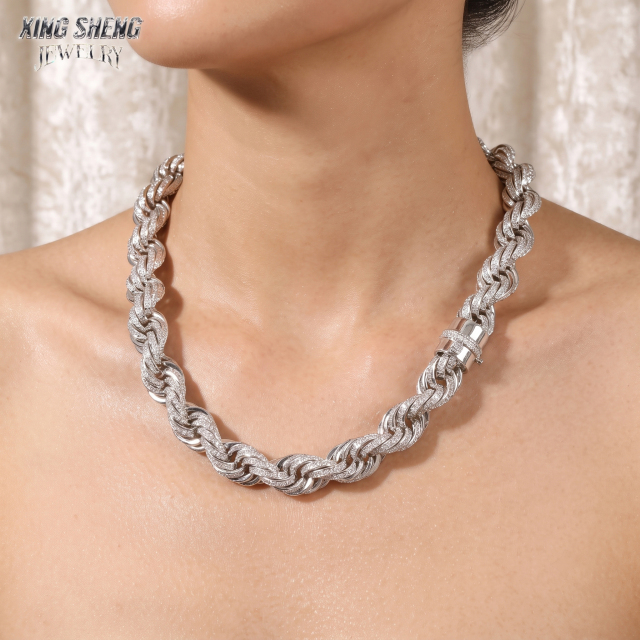 Close-up portrait of a female model wearing the brilliantly reflective 10mm moissanite rope chain against bare skin.