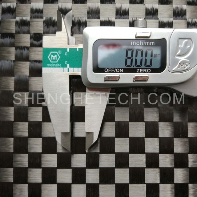 Stretch woven carbon fabric